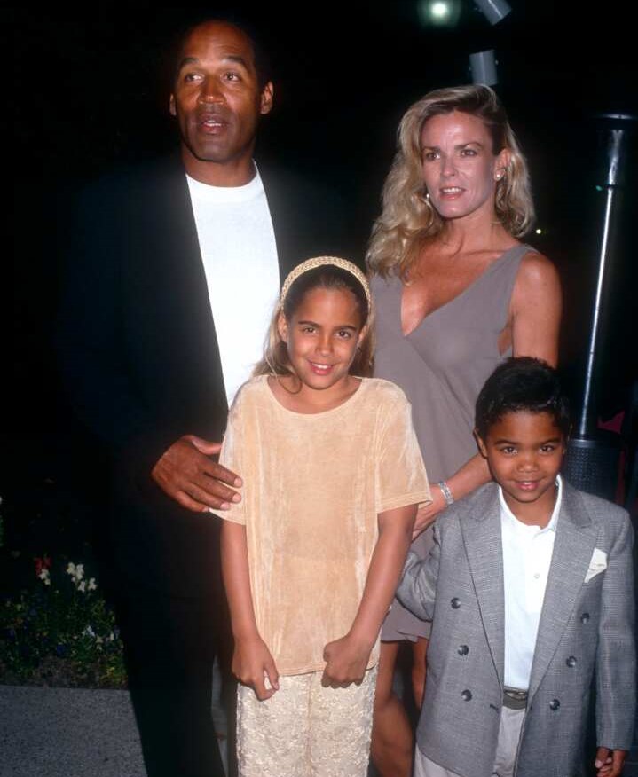 O.J. Simpson and Nicole Brown, accompanied by their children, grace the red carpet at the Hollywood Premiere of 'Naked Gun 33 1/3: The Final Insult' in California. The moment is captured in a photo by @Ron Davis/Getty Images. Source: Getty Images.